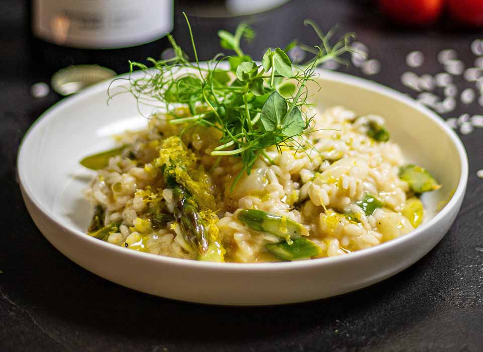 plate of risotto with asparagus